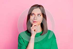 Photo portrait of nice young lady skeptical look empty space not believe doubt dressed trendy green look isolated on