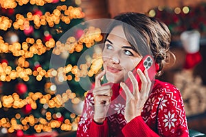 Photo portrait of noel traditions girl young age first winter holiday with new friends calling phone waiting isolated at