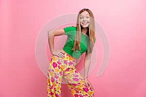 Photo portrait of pretty teenager girl posing defile shopping promo wear trendy green outfit  on pink color photo