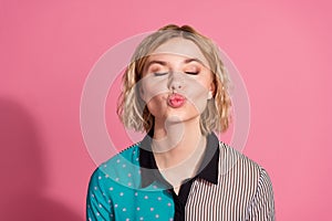 Photo portrait of pretty young girl closed eyes kiss wear trendy striped cyan outfit isolated on pink color background