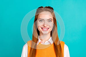 Photo portrait of pretty young girl toothy smile look camera wear trendy orange knitwear outfit isolated on cyan color