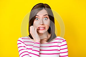 Photo portrait of pretty young woman frighten terrible news bite nails dressed stylish striped clothes isolated on