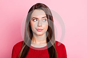 Photo portrait of suspicious unsure girl with straight brunette hair looking at side isolated on pink color background