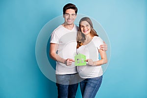 Photo portrait of two people happy couple moving to new home pregnant wife waiting child isolated bright blue color