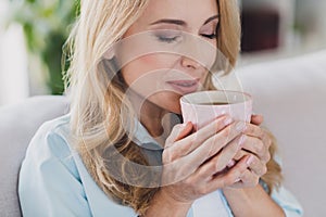 Photo portrait woman blonde hair enjoying coffee aroma drinking beverage relaxing alone