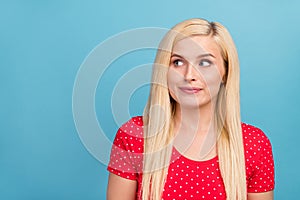 Photo portrait woman blonde hair in red clothes smiling looking copyspace isolated pastel blue color background