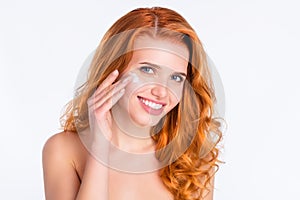 Photo portrait of woman curly red hair smooth skin applying moisturizer cream isolated white color background