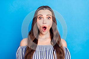 Photo portrait woman long hair in striped blouse amazed stare with opened mouth isolated bright blue color background