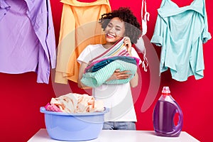 Photo portrait woman smiling with clean clothes isolated vibrant red color background