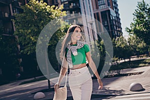 Photo portrait of young brunette lady going wear luxurious casual outfit bring handbag accessory looking a side outside