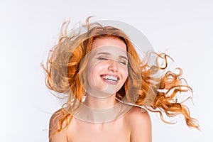 Photo portrait of young woman curly red hair smooth skin laughing flying hair naked shoulders isolated white color