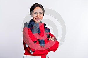 Photo of positive charming young lady paramedic dressed red uniform smiling hands folded isolated white color background