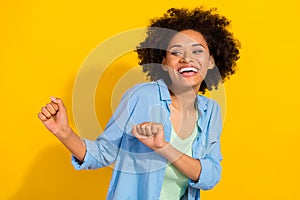 Photo of positive cheerful lady dance discotheque toothy smile wear jeans shirt isolated yellow color background