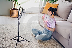 Photo of positive good mood woman dressed striped purple t-shirt beauty vlogging modern gadget indoors house apartment photo