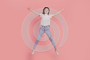 Photo of positive jumper carefree funny lady jump have fun isolated on pink color background