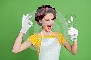 Photo positive maid girl use dishwasher clean whine glass enjoy good quality show okay sign wink blink wear yellow