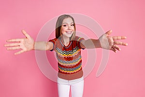 Photo of positive nice girl toothy smile raise opened arms welcome invite you isolated on pink color background