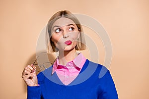 Photo of pouted red pomade lips lady executive assistant takes off glasses look empty space thoughtful isolated on beige