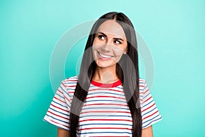 Photo of pretty brunette woman look empty space beaming smile wear striped t-shirt isolated teal color background