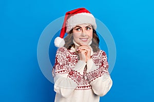 Photo of pretty cute lady wear trendy ugly jumper interested look empty space wait saint nicholas gifts  on blue