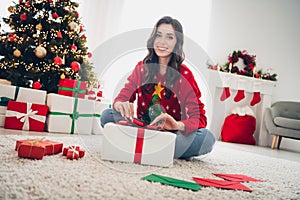 Photo of pretty cute positive lady on floor stayed home alone pack orders handmade shop comfort houseroom interior photo