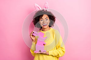 Photo of pretty excited woman dressed kitted pullover easter headband holding rabbit isolated pink color background