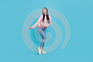 Photo of pretty funky lady dressed print pullover dancing empty space  blue color background