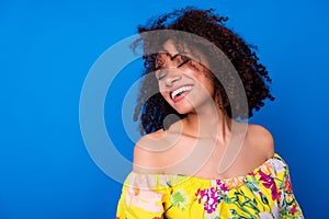 Photo of pretty lovely girl closed eyes toothy beaming smile isolated on blue color background