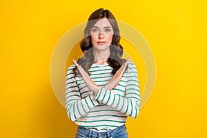 Photo of pretty lovely girlish woman with curly hairstyle wear striped shirt hold arms crossed isolated on yellow color
