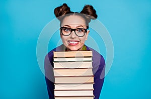 Photo of pretty student lady two funny buns leaning head chin books pile diligent pupil visit library fond of reading