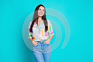 Photo of pretty young woman look empty space think wear shirt isolated on teal color background