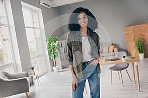 Photo of pretty young woman toothy smile posing wear khaki shirt modern interior house indoors