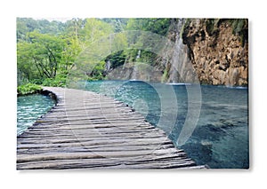 Photo printed on canvas, white background. Wooden bridge over lake and beautiful view of waterfall