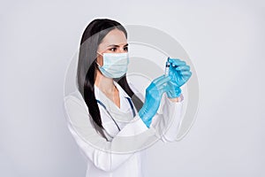 Photo of professional doc lady ready for operation young surgeon hold anesthesia syringe wear mask gloves stethoscope