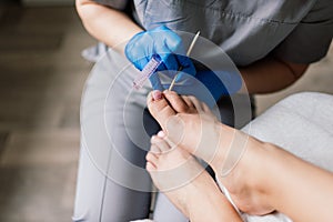 Photo of the professional pedicure process with the model