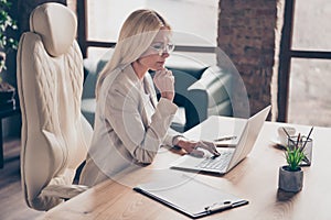 Photo of professional qualified executive assistant wearing glasses spectacles searching for new information about