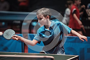 Professional table tennis player young boy. Junior. Championship tournament.