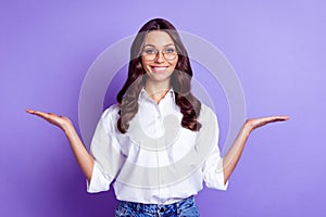 Photo of promoter lady hands hold empty spaces beaming smile wear glasses white shirt isolated purple color background