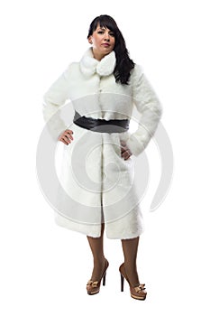 Photo of pudgy brunette in long white coat