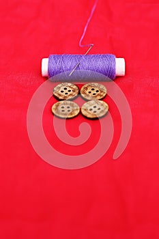 Photo of purple Sewing thread and button