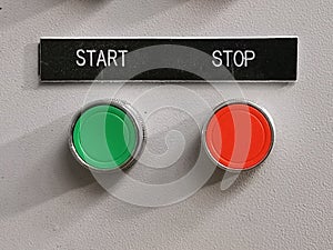 Photo of push buttons mounted on electrical cabinet door.