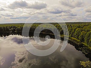 Photo from a quadrocopter of a magic lake in the taiga of Russia