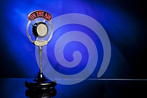 Photo of radio microphone on blue background