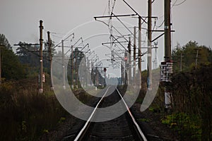 Photo Railroad Tracks in the suburbs taken in the evening