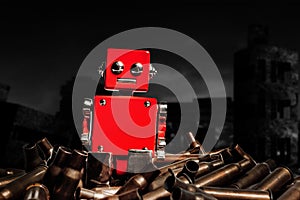 Photo of red robot sitting among a pile of bullet shells