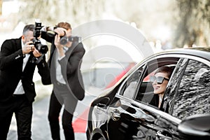 Photo reporters photographing actress ariving on the awards ceremony