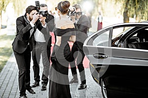 Photo reporters photographing actress ariving on the awards ceremony