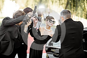 Photo reporters photographing actress ariving on the awards ceremony