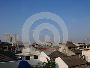 Photo of a residential house from above at noon