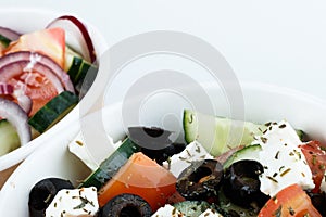 Photo for restaurant menu. Greeck salad and cesar salad isolated on white background. top view